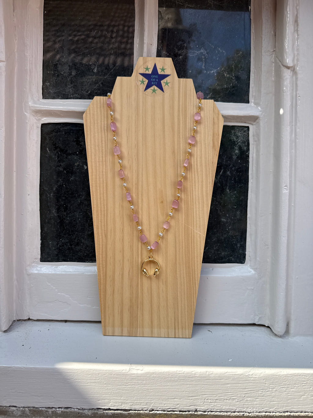 Pink and pearl short headphone necklace