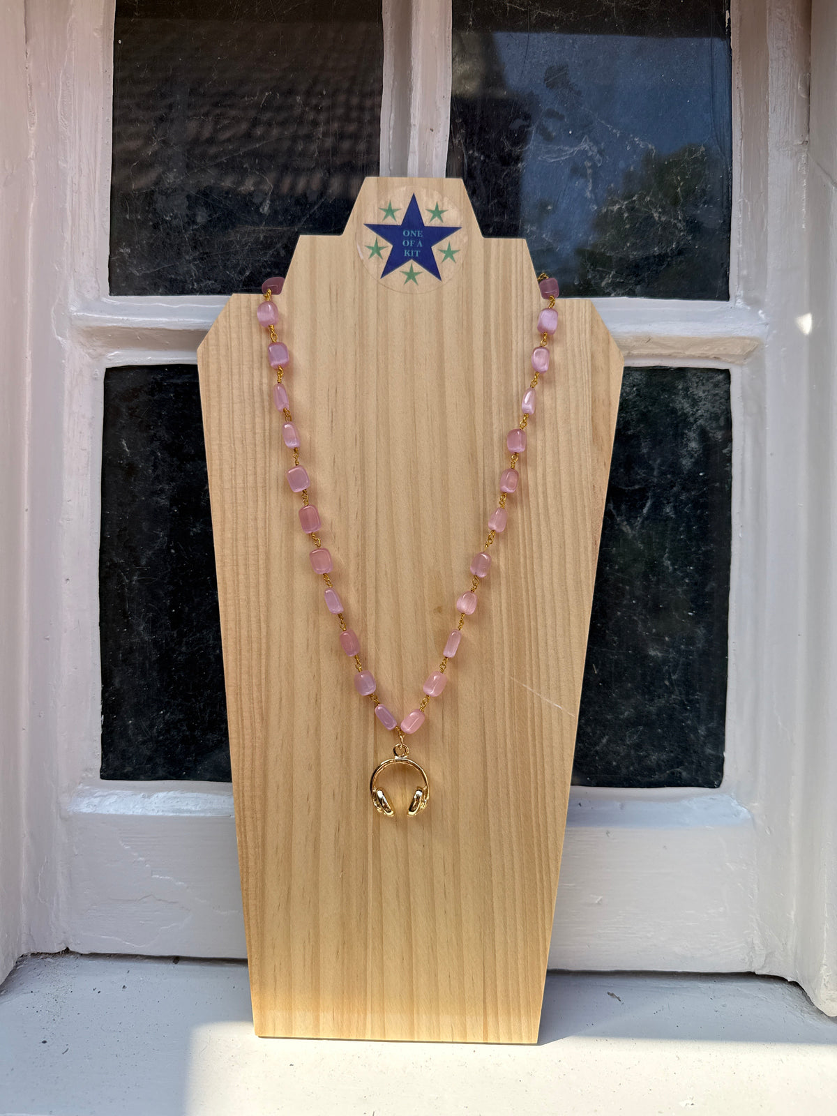 Short pink headphone necklace